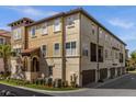 Three-story townhome with a two-car garage and attractive landscaping at 637 Pavia Loop, Lake Mary, FL 32746