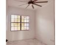 Well-lit bedroom with large window and marble floors at 32702 View Haven Ln, Sorrento, FL 32776