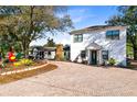 Brick driveway leads to two-story house with unique landscaping at 500 Freyer Dr, Longwood, FL 32750