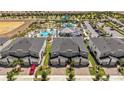 Overhead view of townhomes near a community pool and water park amenities at 1065 Splash Shot Pl # 1801, Davenport, FL 33896