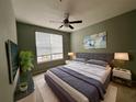 Spacious bedroom with a king-size bed and calming color scheme at 12825 Madison Pointe Cir # 205, Orlando, FL 32821