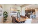 Elegant dining room with a long wooden table and stylish decor at 1677 Andover Ridge Dr, Deland, FL 32720