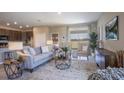 Bright living room featuring comfortable seating and large window with a view at 1677 Andover Ridge Dr, Deland, FL 32720
