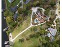 Aerial view of a home with a large yard, pool, and waterfront access at 208 Green Lake Cir, Longwood, FL 32779