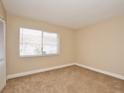 Spacious bedroom with carpet and large window at 4791 S Texas Ave # 4791D, Orlando, FL 32839