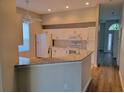 Kitchen features granite countertops and white cabinets at 13620 Waterhouse Way, Orlando, FL 32828