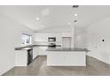 Spacious kitchen with stainless steel appliances, granite countertops, and a large center island at 2633 Hancock Crossing Dr, Bartow, FL 33830
