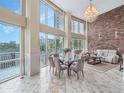 Well-lit living and dining area featuring large windows with beautiful views and modern decor at 322 E Central Blvd # 401, Orlando, FL 32801