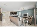 Open living room featuring tile floors and comfortable seating at 8831 Interlocking Ct, Davenport, FL 33896
