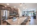 Modern kitchen with stainless steel appliances and an island at 5599 Maddie Dr, Haines City, FL 33845