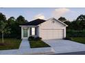 Cozy single-story home with neutral siding, a black roof, and a two-car garage at 2751 San Marco Way, Winter Haven, FL 33884