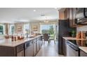 Beautiful kitchen with stainless steel appliances and a view to living area at 2755 San Marco Way, Winter Haven, FL 33884