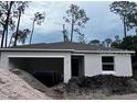 Image of a house still under construction, in a developing neighborhood, with lots ready for building at 1445 General Mac Arthur Ave, Daytona Beach, FL 32114