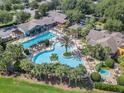 Community pool with surrounding lounge areas and landscaping at 4223 Arlington Ridge Blvd, Leesburg, FL 34748