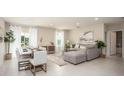Open living and dining area with a comfortable seating arrangement at 704 Village Ct, Fruitland Park, FL 34731