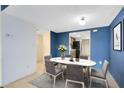 Dining area with a staged table and chairs, near kitchen at 818 Park Lake Cir # 10, Maitland, FL 32751