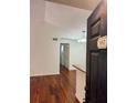 Inviting living room showcasing beautiful hardwood floors and modern lighting fixture at 5132 Conroy Rd # 937, Orlando, FL 32811