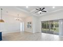 Spacious living area with sliding glass doors leading to the backyard at 3018 Avalon Ridge Ln, Winter Garden, FL 34787