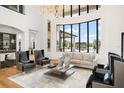Open-concept living room features large windows offering outdoor views and natural light at 4029 Isabella Cir, Windermere, FL 34786