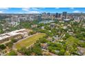 Stunning aerial view of downtown Orlando featuring skyscrapers, a lake, and lush greenery at 809 E Ridgewood St, Orlando, FL 32803