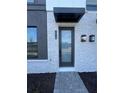 Modern front door with glass panels and brick facade at 2018 Packing District Way, Orlando, FL 32804