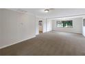 Spacious living room with neutral color palette and ample natural light at 1111 28Th Nw St, Winter Haven, FL 33881