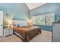 Main bedroom with vaulted ceilings and window at 213 Crown Oaks Way # 213, Longwood, FL 32779