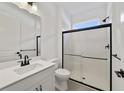 Modern bathroom featuring a glass-enclosed shower and sleek fixtures at 2138 Forest Cir # 32, Orlando, FL 32803