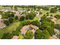 Aerial view of condo complex with lush trees and golf course at 7250 Westpointe Blvd # 1035, Orlando, FL 32835