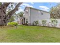 Two-story house with a side yard, white fence and landscaping at 222 Emmy Cv, Oviedo, FL 32765