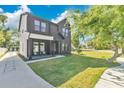 Charming two-story home with a well-manicured lawn, providing a welcoming and picturesque curb appeal at 3480 Fairway Ln, Orlando, FL 32804