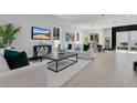 Bright, open-concept living room and dining area with modern decor and ample natural light at 3480 Fairway Ln, Orlando, FL 32804
