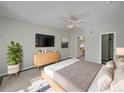 Main bedroom with ensuite bathroom and walk-in closet at 340 Troon Cir, Davenport, FL 33897