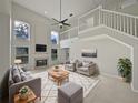 Spacious living room with fireplace and high ceilings at 340 Troon Cir, Davenport, FL 33897