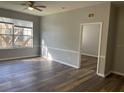 Bright living room with wood-look floors and neutral walls at 6100 Stevenson Dr # 207, Orlando, FL 32835