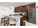 Modern kitchen with stainless steel appliances and an island at 122 Blue Cypress Drive, Davenport, FL 33837