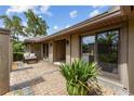 Outdoor patio area with brick pavers and lush landscaping at 9227 Cypress Cove Dr, Orlando, FL 32819