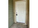 A close-up of the property's front door that is a six panel door at 2444 Summerfield Way # 1, Kissimmee, FL 34741