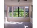 Bright room with large windows offering natural light, blinds, and a ceiling fan at 911 N Orange Ave # 335, Orlando, FL 32801