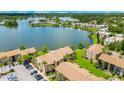 Scenic aerial view of the condo community near a beautiful lake and lush greenery at 574 Orange Dr # 78, Altamonte Springs, FL 32701