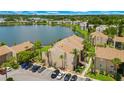 Stunning aerial view of the condo complex nestled alongside a serene lake at 574 Orange Dr # 78, Altamonte Springs, FL 32701