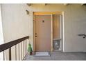 A welcoming front door to a stylish condo with a decorative welcome mat and decorations at 574 Orange Dr # 78, Altamonte Springs, FL 32701