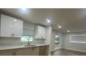 Bright kitchen with stainless steel appliances, sleek countertops, and ample natural light at 2806 Bonneville Dr, Orlando, FL 32826