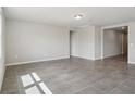 Bright and spacious living room features neutral paint, tile floors, recessed lighting, and large windows at 1709 Forest Run Ln, Auburndale, FL 33823