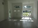 Bright and airy living room featuring large windows and modern flooring at 531 Rhodes Dr, Deland, FL 32720