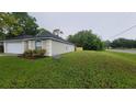 Charming single-story home with a well-manicured lawn and a convenient attached garage at 1312 Swiss Ln, Deltona, FL 32738