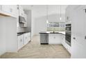 Bright, modern kitchen with stainless steel appliances and ample cabinet space at 5267 Stone Ridge Pl, St Cloud, FL 34771