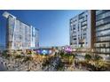 Outdoor plaza with palm trees, restaurants, shopping, and entertainment venues that create a vibrant space at 155 S Court Ave # 1610, Orlando, FL 32801