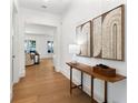 Bright and airy entryway with hardwood floors and stylish decor at 1840 Biscayne Dr, Winter Park, FL 32789