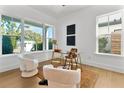Modern home office featuring large windows and comfortable seating at 1840 Biscayne Dr, Winter Park, FL 32789